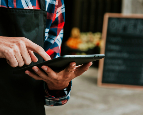Small business owner using AI on tablet